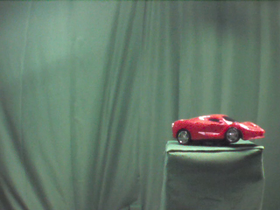90 Degrees _ Picture 9 _ Red Toy Sportscar.png